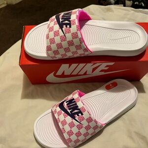 New pink and white Nike slides